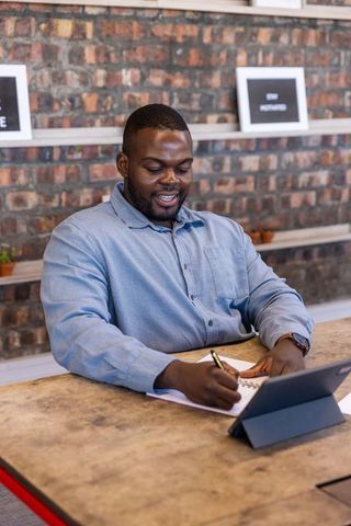 Confident african american professional engaged in productive office work