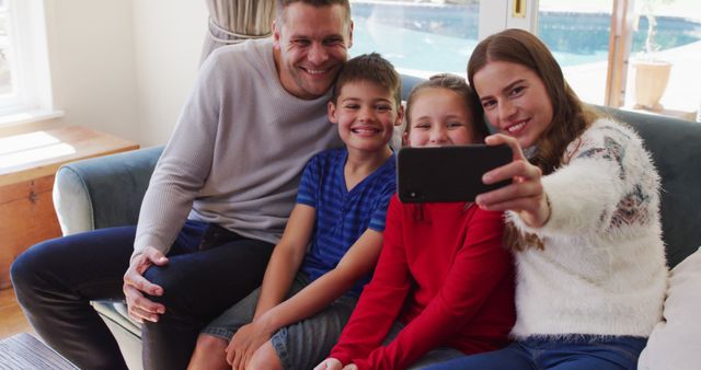 Happy Family Taking Selfie Together on Couch - Download Free Stock Images Pikwizard.com