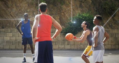 Men Playing Basketball on Outdoor Court Promoting Fitness and Teamwork