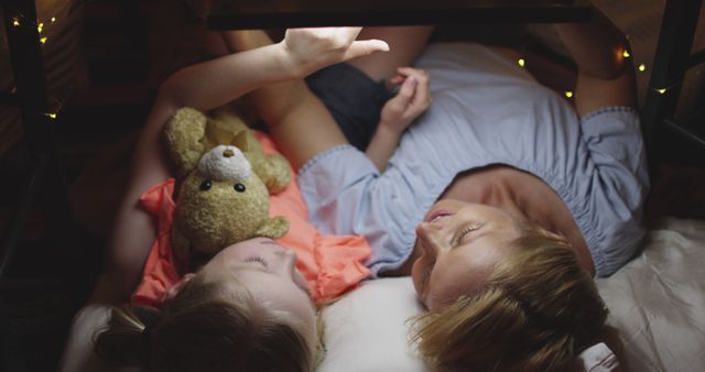 Mother And Daughter Reading Book Together In Blanket Fort - Download Free Stock Images Pikwizard.com