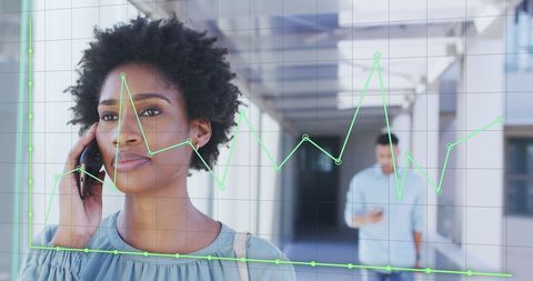 Businesswoman with Smartphone Analyzing Financial Data Overlay