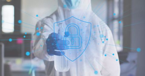 Digital security concept with man in safety suit disinfecting office