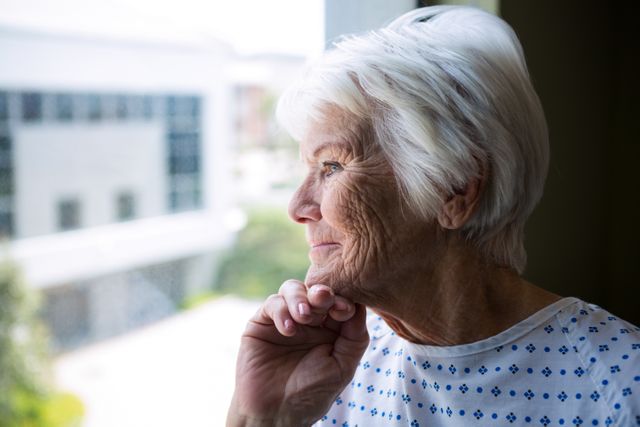 Thoughtful Senior Patient Looking Out Hospital Window - Download Free Stock Photos Pikwizard.com