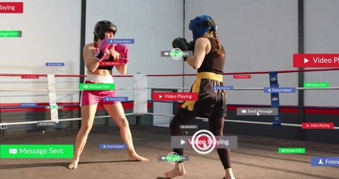 Female boxers sparring with ar hud overlays in gym ring wearing headgear gloves training