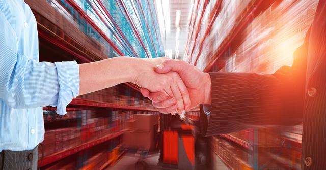 Business Handshake in Warehouse Setting Signifying Successful Partnership - Download Free Stock Photos Pikwizard.com