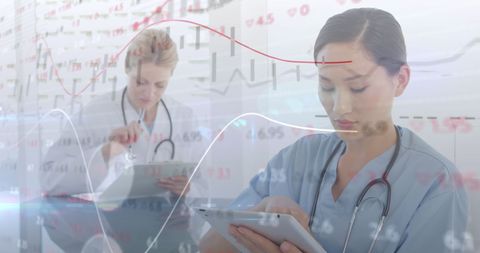 Female Doctors Analyzing Data with Digital Interface