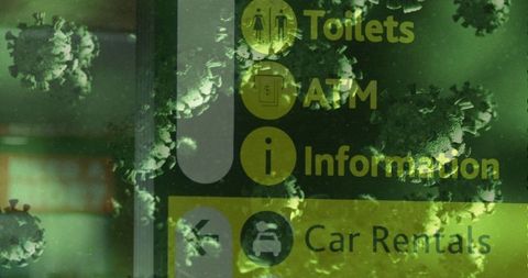Conceptual airport signage overlaid with coronavirus cells