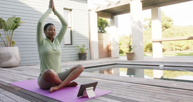 Woman Practicing Yoga Poolside At Peaceful Home Patio - Download Free Stock Images Pikwizard.com