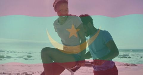 Active couple exercising on sunny beach with flag overlay