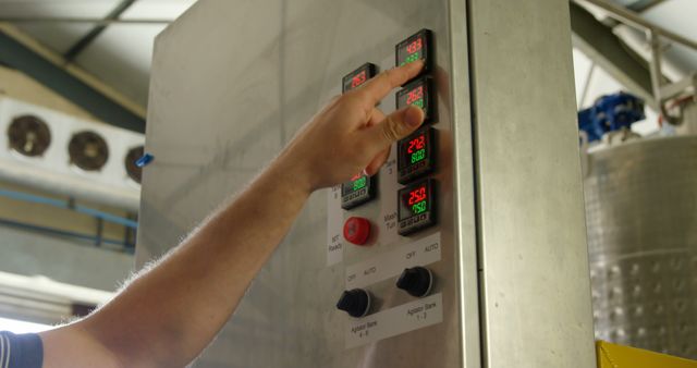 Engineer Adjusting Machine Control Panel On Factory Floor - Download Free Stock Images Pikwizard.com