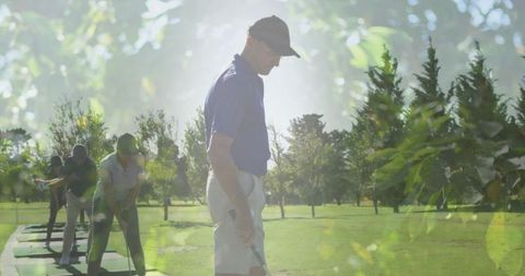 Senior Man Golfing on Sunlit Course with Nature Overlay