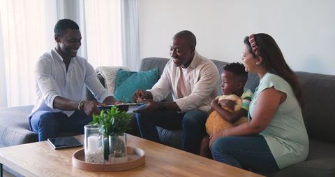 Family consultation with advisor in cozy living room setting