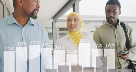 Diverse Business Team Analyzing Data Concepts in Modern Office