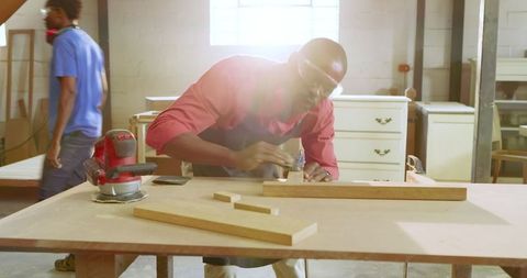 Skilled Woodworkers Crafting in Collaborative Workshop Environment