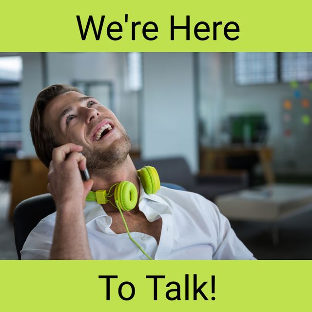 Smiling Businessman With Headphones Using Phone in Office - Download Free Stock Templates Pikwizard.com