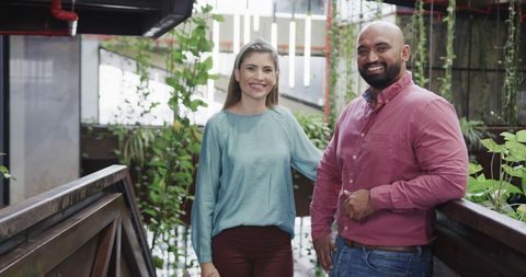 Smiling Diverse Business Colleagues in Indoor Terrace Patio