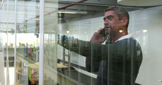 Businessman on Phone in Modern Office Building - Download Free Stock Images Pikwizard.com