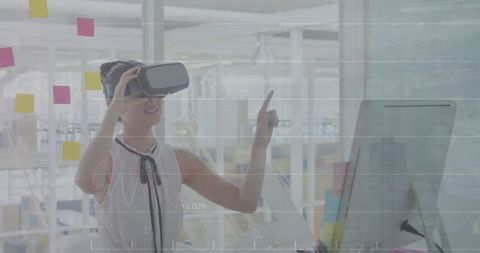 Innovative woman using virtual reality in modern office