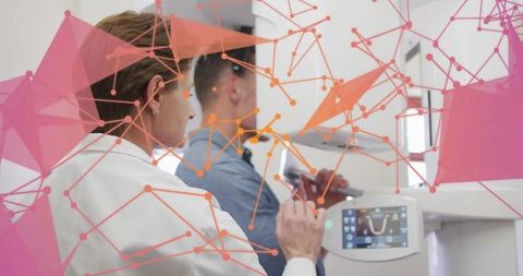 Dentist guiding patient during panoramic dental x-ray with digital network overlay aiding diagnostic
