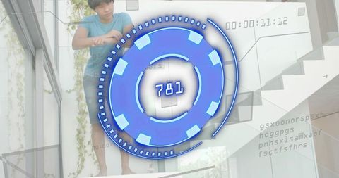 Young man leaning on glass railing wearing blue tee and shorts with ar hud 781 in atrium