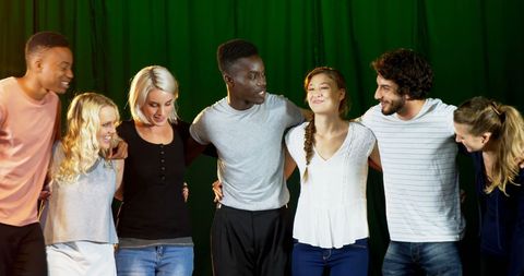 Diverse Young Adults Embracing Team Spirit in Social Gathering - Download Free Stock Images Pikwizard.com