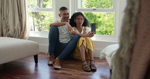Joyful Couple at Home Taking Selfie on Smartphone