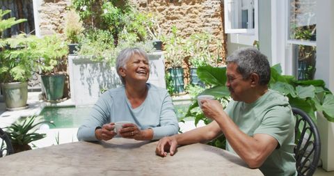 Senior Couple Enjoying Coffee in Tranquil Garden