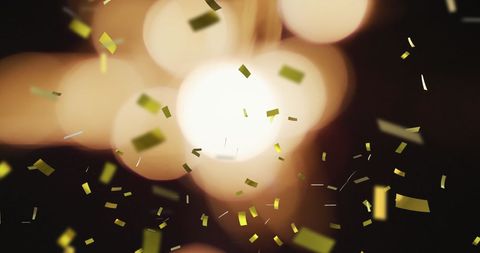 Festive Golden Confetti Falling on Dark Background - Download Free Stock Images Pikwizard.com