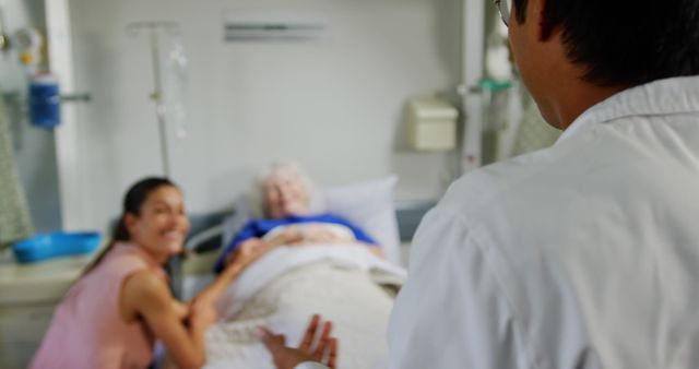 Doctor Checkup with Family Visitation in Hospital Room - Download Free Stock Images Pikwizard.com