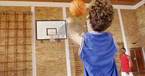 Teen Basketball Player Shooting Hoops in School Gym