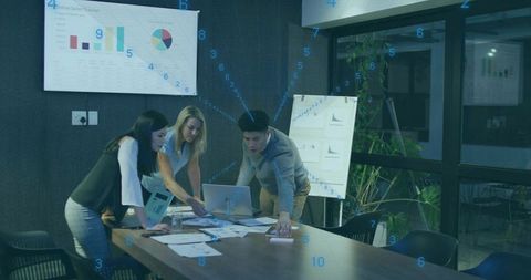 Business Team Analyzing Sales Data in Modern Conference Room