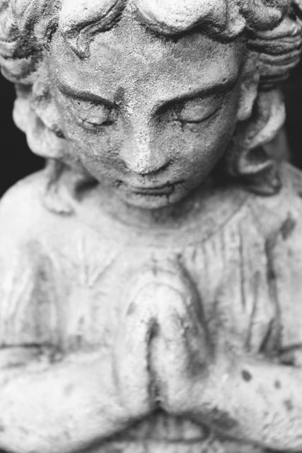 Close-Up of Weathered Angel Statue in Prayer - Download Free Stock Photos Pikwizard.com