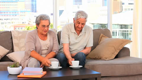 Elderly Couple Enjoying Tea Together at Home