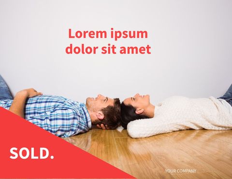 Happy couple lying on floor celebrating new home