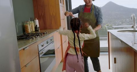 Happy Mother and Daughter Bonding in Modern Bright Kitchen