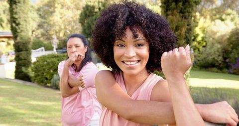Women Enjoying Outdoor Fitness Routine in Nature Setting