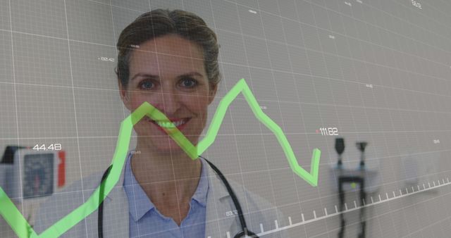 Smiling Doctor in Front of Medical Graph with Stethoscope in Clinic - Download Free Stock Images Pikwizard.com