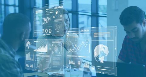 Colleagues collaborating with augmented reality dashboards and global analytics in office