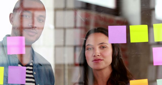 Diverse Team Strategizing with Colorful Sticky Notes in Office - Download Free Stock Images Pikwizard.com