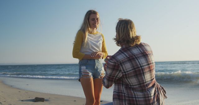 Man Proposing to Girlfriend on Beach at Sunset - Download Free Stock Images Pikwizard.com