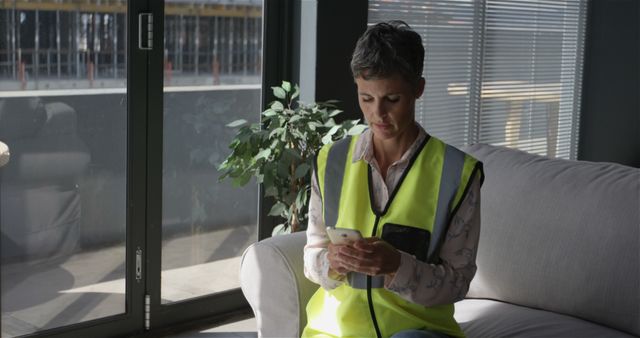 Female Architect Using Smartphone in Modern Office - Download Free Stock Images Pikwizard.com