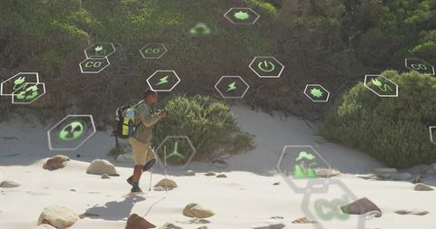 Hiker exploring coastal dunes and using augmented reality eco icons for sustainable trek