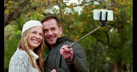 Middle-Aged Couple Taking Selfie in Autumn Park - Download Free Stock Images Pikwizard.com