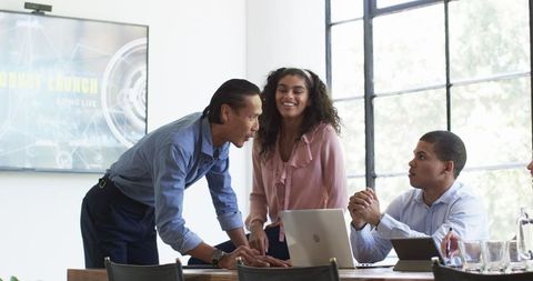 Multiracial team collaboration in office meeting