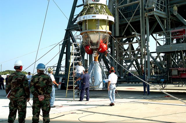 KENNEDY SPACE CENTER, FLA. - The second stage of a Delta II rocket is raised to a vertical position for its lift up the launch tower on Pad 17-B, Cape Canaveral Air Force Station.  It will be mated to the Delta first stage already at the pad in preparation for the launch of the Mars Exploration Rover-1 (MER-B) on June 25.  NASA’s twin Mars Exploration Rovers are designed to study the history of water on Mars. These robotic geologists are equipped with a robotic arm, a drilling tool, three spectrometers, and four pairs of cameras that allow them to have a human-like, 3D view of the terrain. Each rover could travel as far as 100 meters in one day to act as Mars scientists' eyes and hands, exploring an environment where humans are not yet able to go. The launch of MER-2 (MER-A) is tentatively set for June 8.
