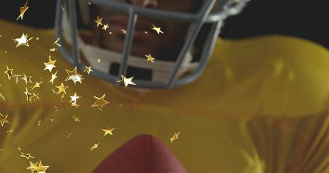 Closeup football player holding ball with silver helmet and gold star celebration effect