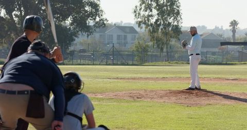 Pitcher Preparing Pitch on Local Baseball Mound with Batter Catcher Umpire, Sunlit Park