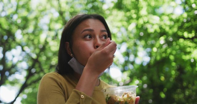 Woman Eating Salad in Park on a Sunny Day - Download Free Stock Images Pikwizard.com