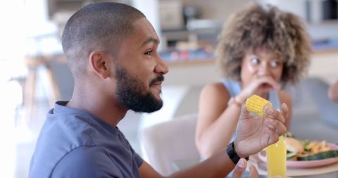 Friends Socializing Over Food During Casual Hangout