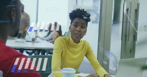 Businesswoman Analyzing Digital Data During Office Meeting